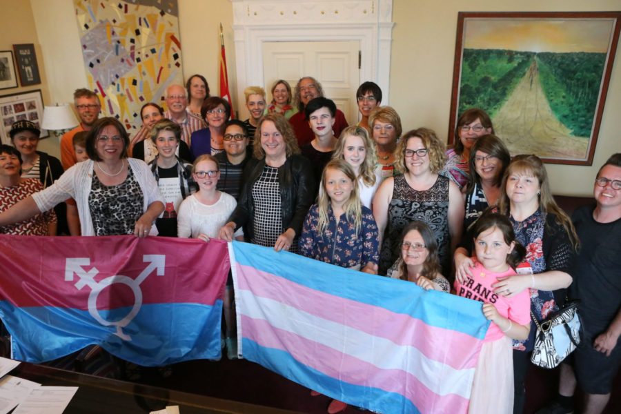 Transgender rights advocates celebrate in Sen. Mitchell’s office after Bill C-16 is adopted at third reading in the Senate on June 15, 2017. (Photo: Greg Kolz)