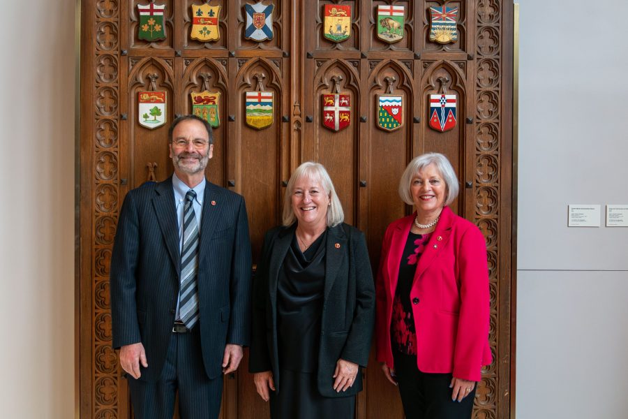 Senator Marc Gold (left) stands with Senator Joan Kingston (centre) and Senator Nancy Hartling (right).  (Photo: Senate of Canada)