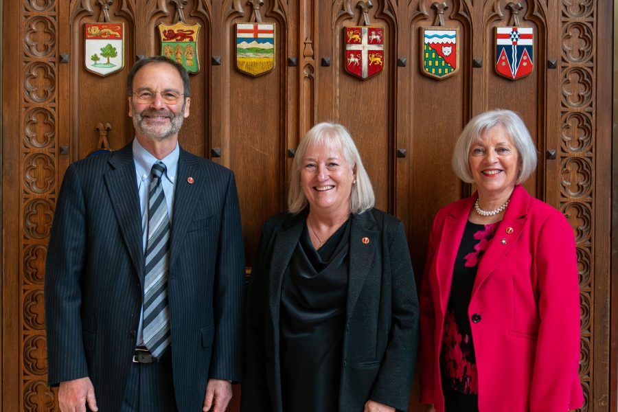 Senator Marc Gold (left) stands with Senator Joan Kingston (centre) and Senator Nancy Hartling (right).  (Photo: Senate of Canada)