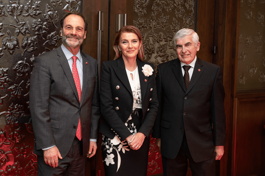 Senator Manuelle Oudar (centre,)stands outside the Red Chamber on February 27, 2024. Also pictured are senators Marc Gold (left) and Clément Gignac (right). Photo Credit: Senate Communications